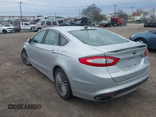 2016 Ford Fusion Titanium with VIN 3FA6P0K93GR117587, listed as a IAAI auction lot 42079701 with 142,105 mi miles. Bid and sale history available at carsss.com. Image 3.