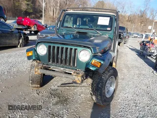 2000 Jeep Wrangler Sahara with VIN 1J4FA59S0YP724521, listed as a IAAI auction lot 41574689 with 167,584 mi miles. Bid and sale history available at carsss.com. Image 12.