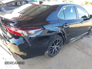 2023 Toyota Camry SE z VIN 4T1G11AKXPU747251, wystawiony jako IAAI lot #42388819 z przebiegiem 39 542 mil mil oraz . Historia ofert i sprzedaży dostępna na DreamBid. Obrazek 6.