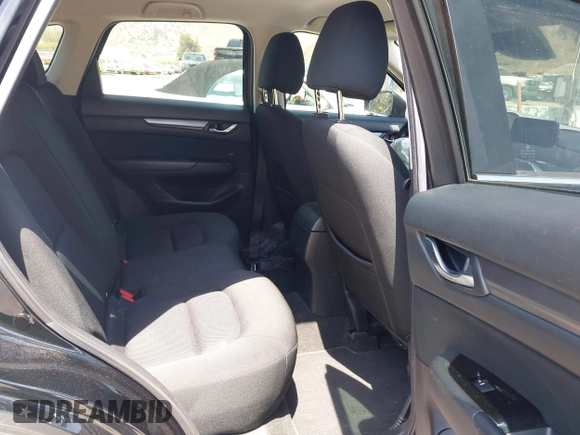 2019 Mazda CX-5 Sport with VIN JM3KFABM7K1509987, listed as a IAAI auction lot 42062804 with 50,898 mi miles and . Bid and sale history available at DreamBid. Image 8.