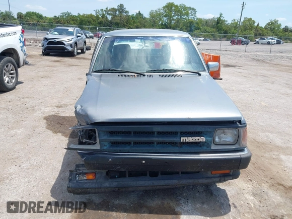 1992 Mazda B-Series Truck with VIN JM2UF313XN0306779, listed as a IAAI auction lot 42104583 with 137,826 mi miles and . Bid and sale history available at DreamBid. Image 12.