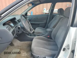 2000 Toyota Camry CE z VIN 4T1BG22K5YU936033, wystawiony jako Copart lot #57636215 z przebiegiem 242 889 mil mil oraz Szkoda całkowita • Salvage title. Historia ofert i sprzedaży dostępna na DreamBid. Obrazek 7.