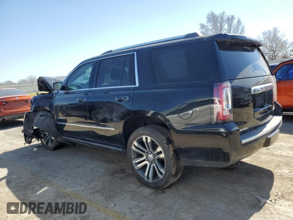 2017 GMC Yukon Denali with VIN 1GKS2CKJXHR389946, listed as a Copart auction lot 48678225 with 156,603 mi miles and Salvage Title. Bid and sale history available at carsss.com. Image 2.