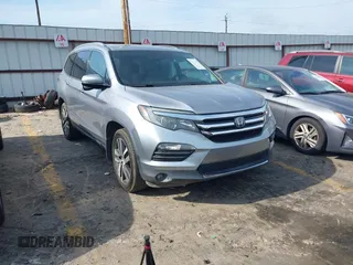 2018 Honda Pilot Touring z VIN 5FNYF5H99JB018095, wystawiony jako IAAI lot #42156519 z przebiegiem 115 475 mil mil oraz . Historia ofert i sprzedaży dostępna na DreamBid. Obrazek 1.