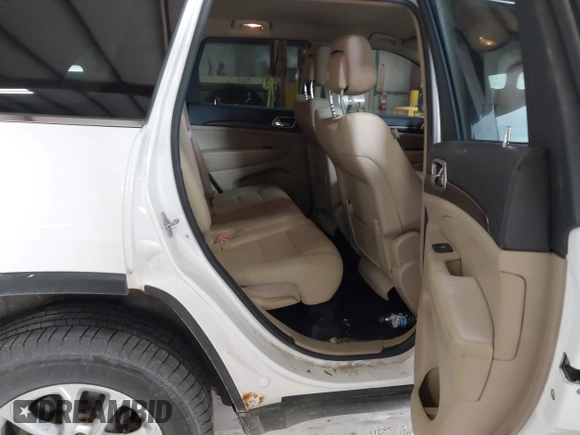 2014 Jeep Grand Cherokee Laredo with VIN 1C4RJFAG4EC309401, listed as a IAAI auction lot 41996233 with 243,541 mi miles and . Bid and sale history available at DreamBid. Image 8.
