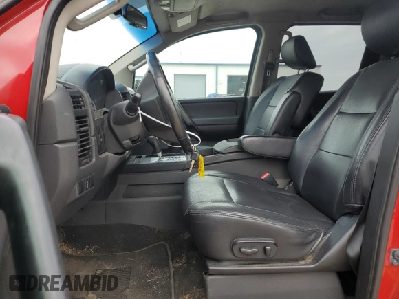 2012 Nissan Titan SV with VIN 1N6BA0EK4CN319941, listed as a Copart auction lot 43640705 with 210,885 mi miles and Salvage Title. Bid and sale history available at DreamBid. Image 7.