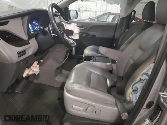 2017 Toyota Sienna XLE with VIN 5TDDZ3DC4HS166141, listed as a Copart auction lot 64357715 with 124,184 mi miles and Salvage title. Bid and sale history available at DreamBid. Image 7.