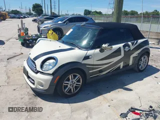 2015 MINI Convertible with VIN WMWZN3C53FT861968, listed as a IAAI auction lot 42717485 with 79,840 mi miles and . Bid and sale history available at DreamBid. Image 2.