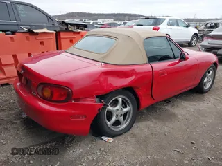 1999 Mazda MX-5 Miata with VIN JM1NB3531X0120856, listed as a IAAI auction lot 41531407 with 92,512 mi miles and . Bid and sale history available at DreamBid. Image 4.