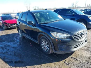 2016 Mazda CX-5 Sport with VIN JM3KE4BY0G0662294, listed as a IAAI auction lot 41469721 with 127,116 mi miles and . Bid and sale history available at carsss.com. Image 1.