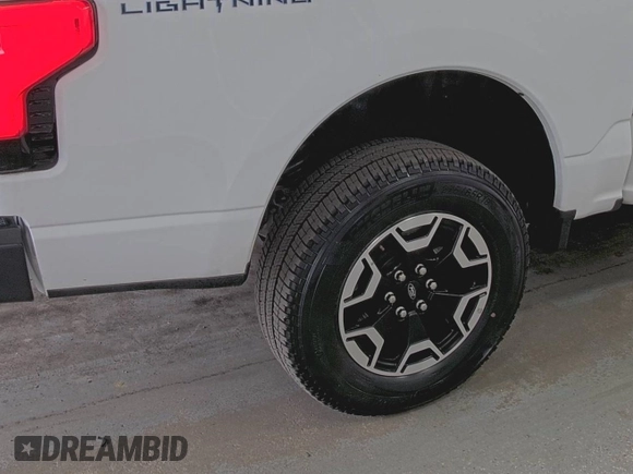 2022 Ford F-150 Lightning Pro with VIN 1FTVW1EL5NWG11725, listed as a IAAI auction lot 42832825 with 5,044 mi miles and . Bid and sale history available at DreamBid. Image 10.