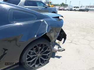 2014 Ford Mustang V6 with VIN 1ZVBP8AM7E5327555, listed as a IAAI auction lot 42316601 with 100,495 mi miles and . Bid and sale history available at DreamBid. Image 6.