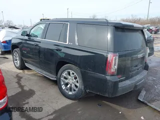 2016 GMC Yukon SLE with VIN 1GKS2AKC3GR398556, listed as a IAAI auction lot 41585972 with 130,961 mi miles. Bid and sale history available at carsss.com. Image 3.
