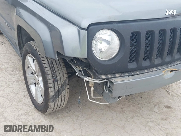 2014 Jeep Patriot Latitude with VIN 1C4NJPFAXED507693, listed as a IAAI auction lot 41701193 with 104,130 mi miles and . Bid and sale history available at DreamBid. Image 6.
