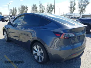 2022 Tesla Model Y Long Range with VIN 7SAYGAEEXNF381389, listed as a IAAI auction lot 41613075 with 52,800 mi miles and . Bid and sale history available at carsss.com. Image 3.