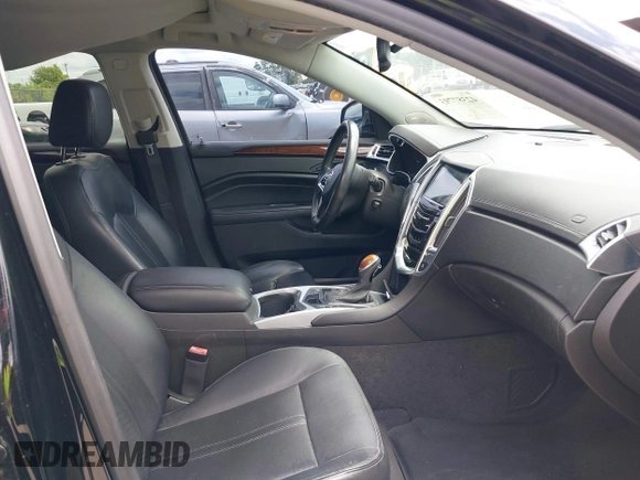 2015 Cadillac SRX Performance Collection z VIN 3GYFNCE31FS597798, wystawiony jako IAAI lot #42387793 z przebiegiem 159 986 mil mil oraz . Historia ofert i sprzedaży dostępna na DreamBid. Obrazek 5.