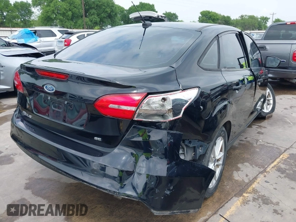 2018 Ford Focus SE with VIN 1FADP3F22JL311975, listed as a IAAI auction lot 41934856 with 68,974 mi miles. Bid and sale history available at carsss.com. Image 4.