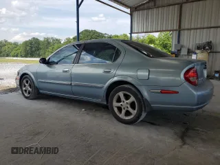 2000 Nissan Maxima GXE with VIN JN1CA31A1YT223132, listed as a Copart auction lot 60148655 with 269,258 mi miles and Salvage title. Bid and sale history available at DreamBid. Image 2.