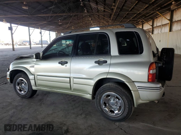 1999 Suzuki Grand Vitara JLX z VIN JS3TD62V3X4123048, wystawiony jako Copart lot #73007124 z przebiegiem 159 828 mil mil oraz Szkoda całkowita • Salvage title. Historia ofert i sprzedaży dostępna na DreamBid. Obrazek 2.