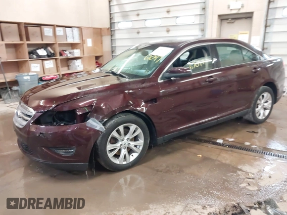 2011 Ford Taurus SEL z VIN 1FAHP2HW5BG141570, wystawiony jako IAAI lot #41867097 z przebiegiem 172 984 mil mil oraz . Historia ofert i sprzedaży dostępna na DreamBid. Obrazek 2.