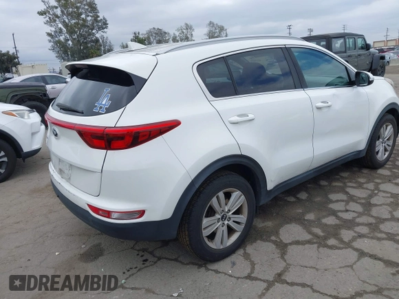 2018 Kia Sportage LX with VIN KNDPM3AC1J7413227, listed as a IAAI auction lot 42188566 with 77,897 mi miles and . Bid and sale history available at carsss.com. Image 4.