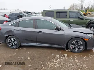 2017 Honda Civic EX-T with VIN 19XFC1F34HE014334, listed as a IAAI auction lot 42009311 with 124,717 mi miles. Bid and sale history available at carsss.com. Image 13.