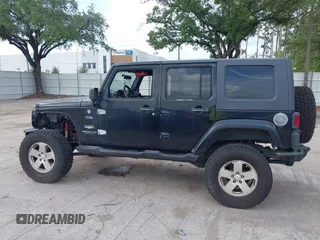 2007 Jeep Wrangler Unlimited Sahara z VIN 1J8GA59187L104774, wystawiony jako IAAI lot #42485359 z przebiegiem 192 254 mil mil oraz . Historia ofert i sprzedaży dostępna na DreamBid. Obrazek 15.
