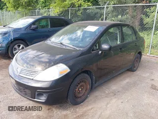 2009 Nissan Versa 1.8 S with VIN 3N1BC11E39L497791, listed as a IAAI auction lot 39679827 with 113,244 mi miles. Bid and sale history available at carsss.com. Image 2.