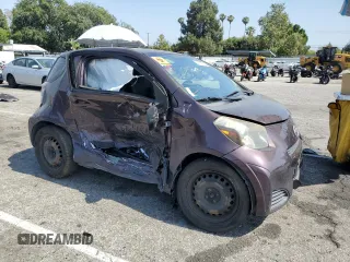 2013 Scion iQ with VIN JTNJJXB05DJ022305, listed as a Copart auction lot 58787155 with 136,046 mi miles and Salvage title. Bid and sale history available at DreamBid. Image 4.