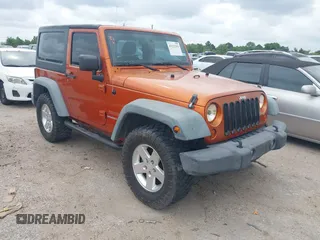 2011 Jeep Wrangler Sport with VIN 1J4AA2D1XBL579882, listed as a IAAI auction lot 42122353 with 153,885 mi miles and . Bid and sale history available at carsss.com. Image 1.
