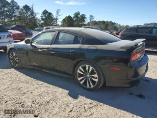 2012 Dodge Charger SRT8 with VIN 2C3CDXEJ4CH228471, listed as a Copart auction lot 82397844 with 125,437 mi miles and Salvage Title. Bid and sale history available at carsss.com. Image 2.