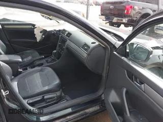 2015 Volkswagen Passat 1.8T Limited Edition with VIN 1VWAT7A31FC111352, listed as a IAAI auction lot 41575307 with 130,080 mi miles. Bid and sale history available at carsss.com. Image 5.
