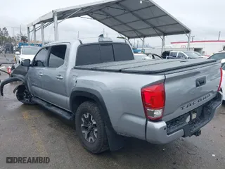 2016 Toyota Tacoma SR with VIN 3TMCZ5ANXGM010164, listed as a IAAI auction lot 41802736 with 201,697 mi miles. Bid and sale history available at carsss.com. Image 3.