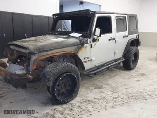 2009 Jeep Wrangler Unlimited X with VIN 1J4GA39159L763484, listed as a IAAI auction lot 40761006 with 1 mi miles. Bid and sale history available at carsss.com. Image 2.