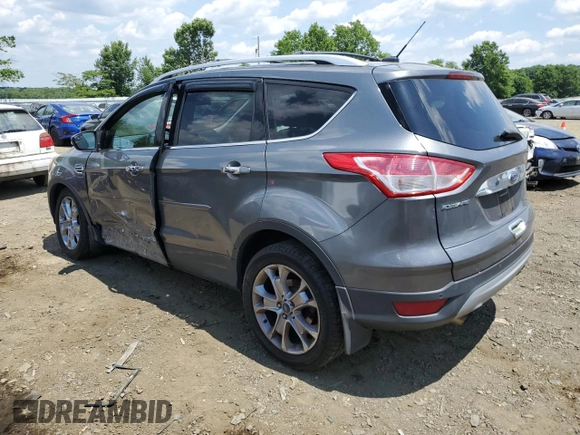 2014 Ford Escape Titanium with VIN 1FMCU9J91EUC90702, listed as a Copart auction lot 59116194 with 117,984 mi miles and Salvage Title. Bid and sale history available at DreamBid. Image 2.