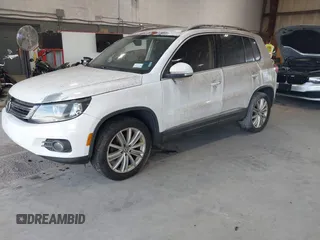 2012 Volkswagen Tiguan SE with VIN WVGAV7AXXCW533237, listed as a IAAI auction lot 42670923 with 227,323 mi miles and . Bid and sale history available at DreamBid. Image 2.