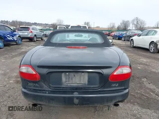 1997 Jaguar XK with VIN SAJGX274XVC017622, listed as a IAAI auction lot 41614339 with 94,298 mi miles and . Bid and sale history available at DreamBid. Image 15.