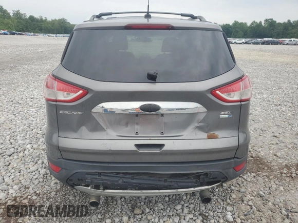 2013 Ford Escape SEL z VIN 1FMCU9HX7DUC11052, wystawiony jako Copart lot #62377515 z przebiegiem 225 704 mil mil oraz Szkoda całkowita • Salvage title. Historia ofert i sprzedaży dostępna na DreamBid. Obrazek 6.