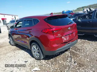 2019 Hyundai Tucson SE with VIN KM8J2CA41KU926156, listed as a IAAI auction lot 41888461 with 91,094 mi miles. Bid and sale history available at carsss.com. Image 3.