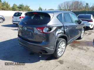 2014 Mazda CX-5 Grand Touring with VIN JM3KE4DY4E0320695, listed as a IAAI auction lot 41989350 with 169,391 mi miles and . Bid and sale history available at DreamBid. Image 4.