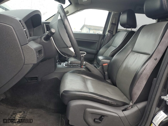 2010 Jeep Grand Cherokee Laredo with VIN 1J4RR4GT7AC120604, listed as a Copart auction lot 84257724 with 60,827 mi miles and Salvage Title. Bid and sale history available at carsss.com. Image 7.