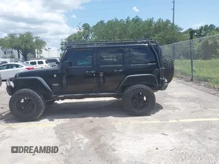 2012 Jeep Wrangler Unlimited Altitude with VIN 1C4HJWEG5CL161049, listed as a IAAI auction lot 42629330 with 217,147 mi miles and . Bid and sale history available at DreamBid. Image 14.