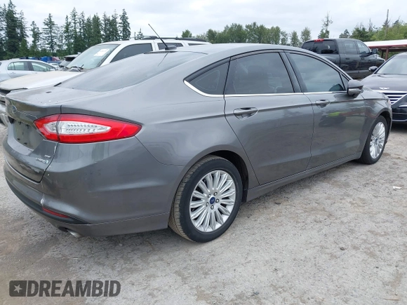 2014 Ford Fusion SE Hybrid with VIN 3FA6P0LU6ER285188, listed as a IAAI auction lot 42516215 with 122,899 mi miles and . Bid and sale history available at DreamBid. Image 4.