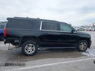 2016 Chevrolet Suburban LT z VIN 1GNSKHKC7GR315884, wystawiony jako IAAI lot #41977108 z przebiegiem 138 902 mil mil oraz . Historia ofert i sprzedaży dostępna na DreamBid. Obrazek 13.