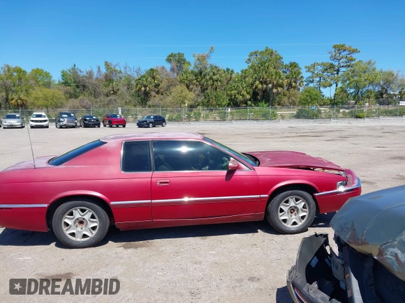 2002 Cadillac Eldorado ESC z VIN 1G6EL12Y72B102153, wystawiony jako IAAI lot #41861541 z przebiegiem 91 273 mil mil oraz . Historia ofert i sprzedaży dostępna na DreamBid. Obrazek 13.