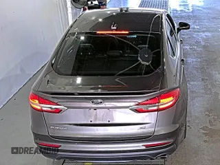 2020 Ford Fusion SE z VIN 3FA6P0HD6LR189762, wystawiony jako IAAI lot #42780149 z przebiegiem 51 099 mil mil oraz . Historia ofert i sprzedaży dostępna na DreamBid. Obrazek 6.