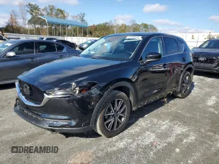 2018 Mazda CX-5 Grand Touring with VIN JM3KFADM5J0325794, listed as a Copart auction lot 79748544 with 106,781 mi miles and Salvage Title. Bid and sale history available at carsss.com. Image 1.