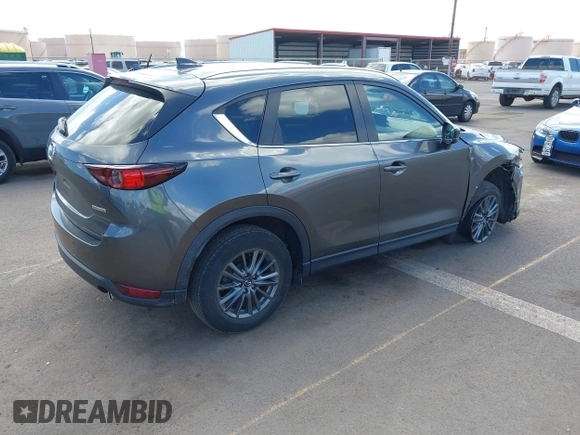 2021 Mazda CX-5 Touring with VIN JM3KFACM2M1348305, listed as a IAAI auction lot 41627199 with 30,044 mi miles. Bid and sale history available at carsss.com. Image 4.