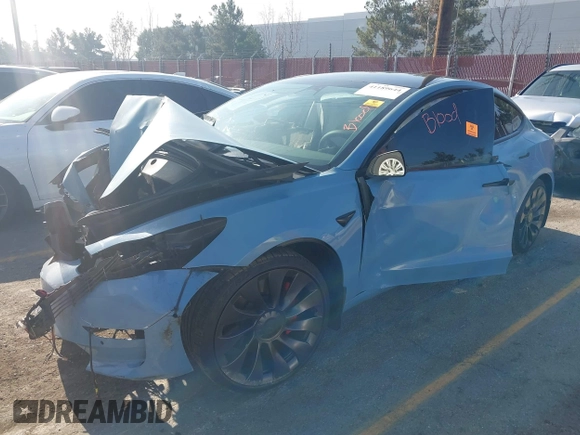 2022 Tesla Model 3 Performance with VIN 5YJ3E1EC1NF144236, listed as a IAAI auction lot 41189644 with Not Provided miles. Bid and sale history available at carsss.com. Image 2.