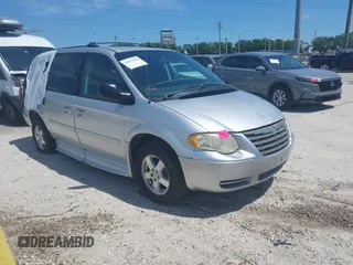 2005 Dodge Caravan SXT with VIN 2D4GP44L85R207743, listed as a IAAI auction lot 41651028 with 56,754 mi miles. Bid and sale history available at carsss.com. Image 1.